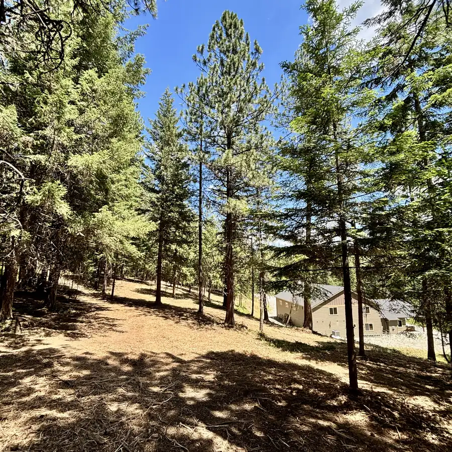 After: open, park-like defensible space around the home